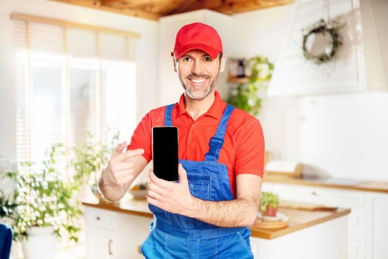 Plumber Using Phone