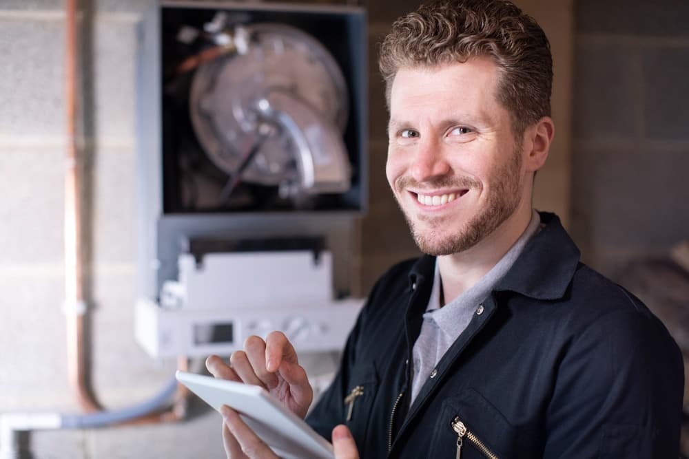 Home Service Professional With Tablet Workiz