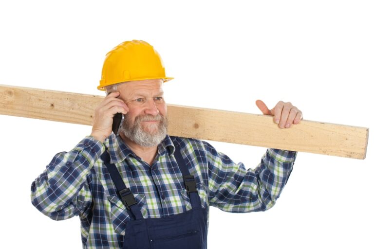 worker holding piece of wood