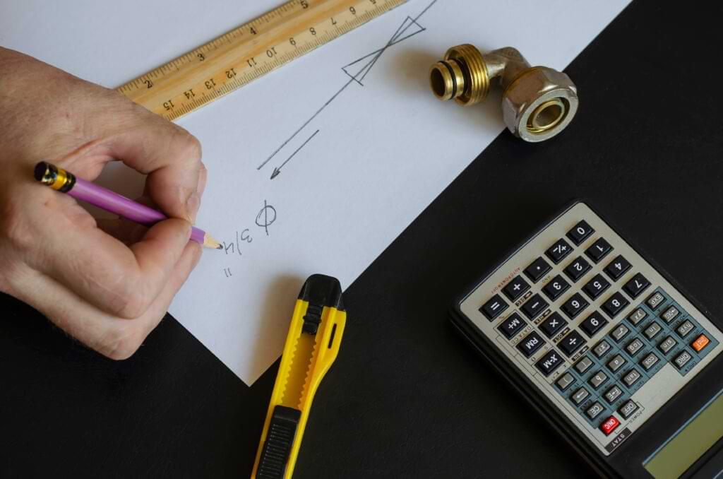 plumber doing some calculations