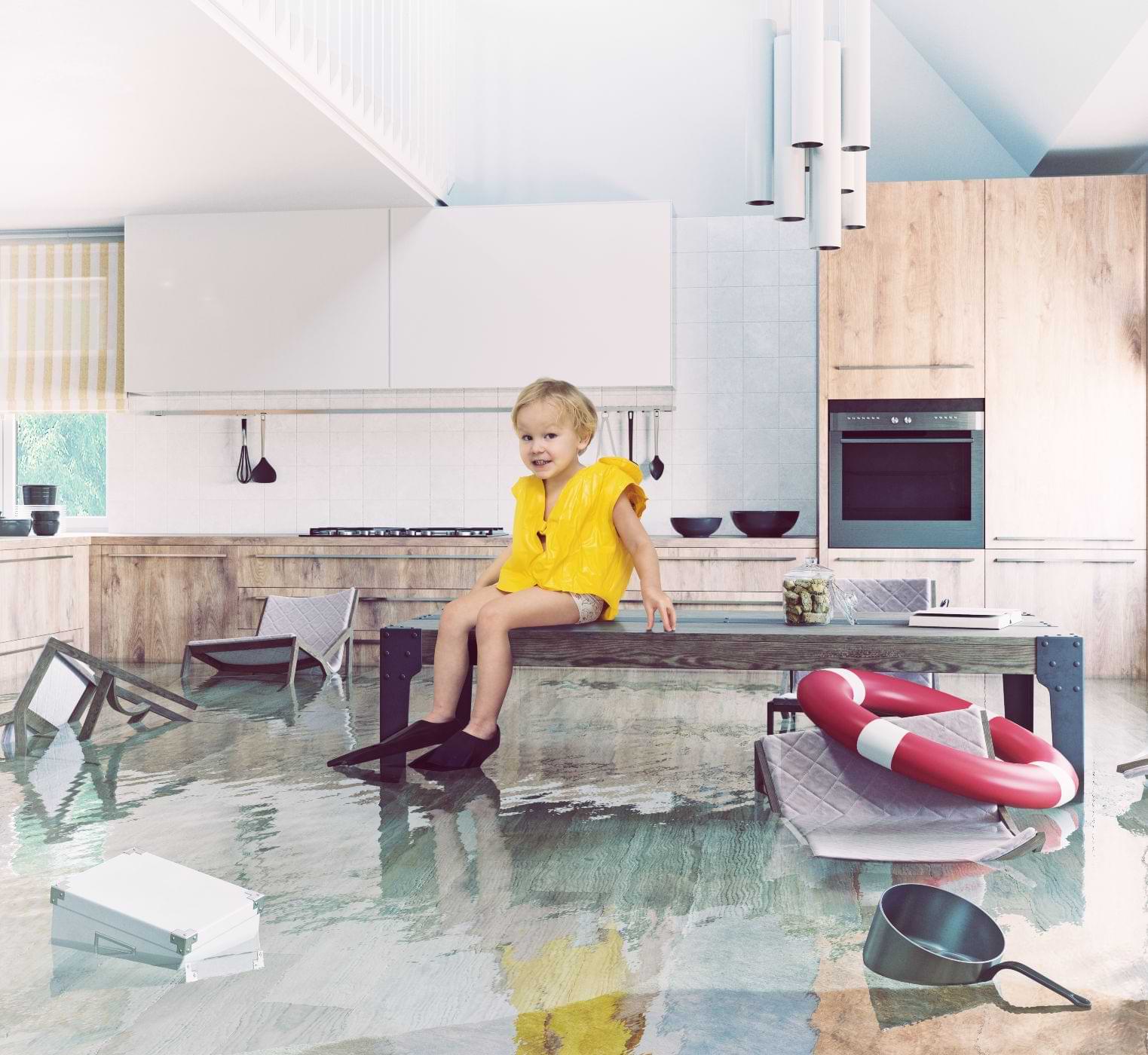 Child Sitting On A Table In A Flooded Kitchen 
