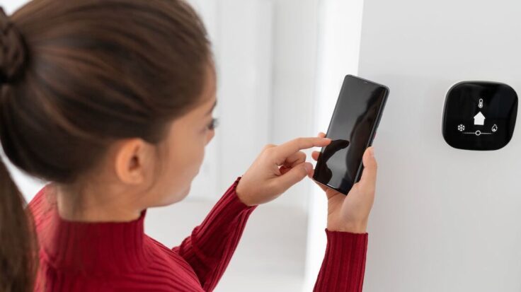 Woman With Hvac Thermostat 1 Aspect Ratio 1472 816