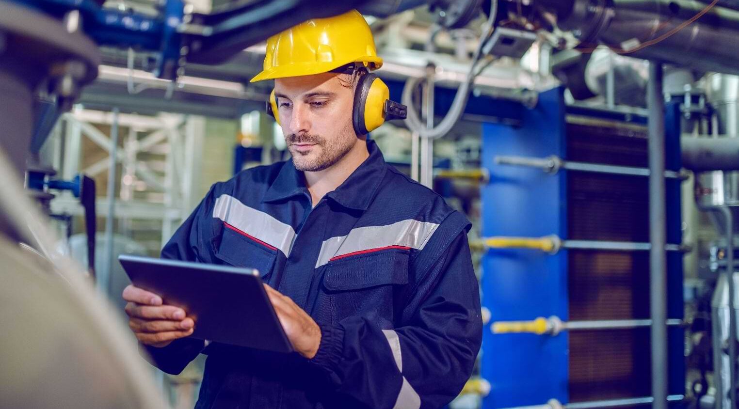 Worker At A Factory Wearing Headphones 1 Aspect Ratio 1472 816