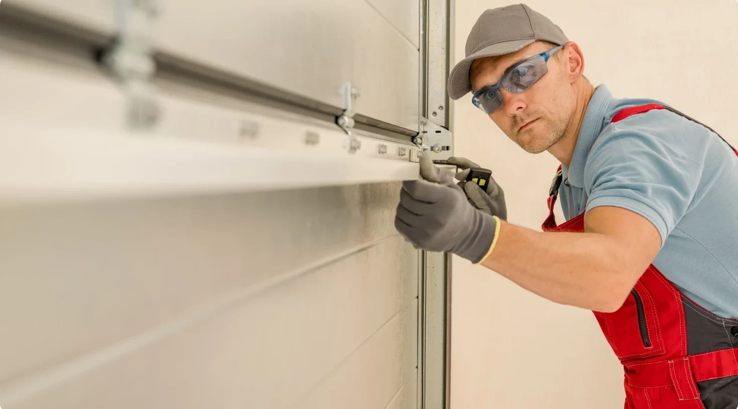Man Installing New Garage Doors Aspect Ratio 1472 816