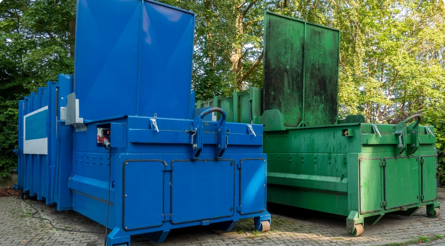 Two Garbage Compactors Aspect Ratio 1472 816